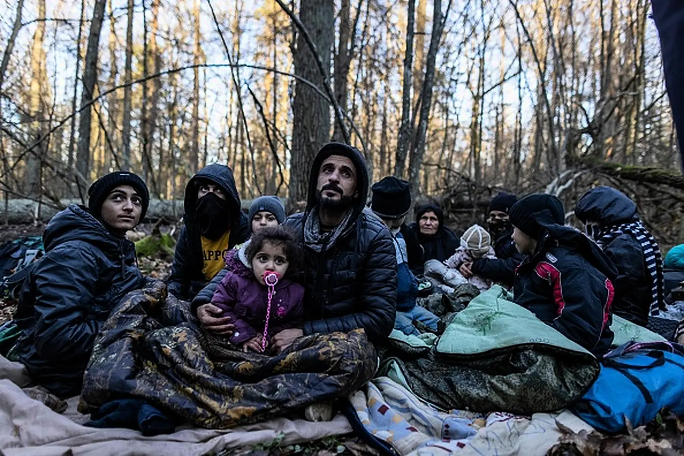 Members Of A Kurdish Family From Dohuk In Iraq In A Forest Near The Polish-Belarus Border. The Three-Generation Family Spent About 20 Days In The Forest And Was Pushed Back To Belarus Eight Times. Photo: Wojtek Radwanski / Afp Via Getty Images