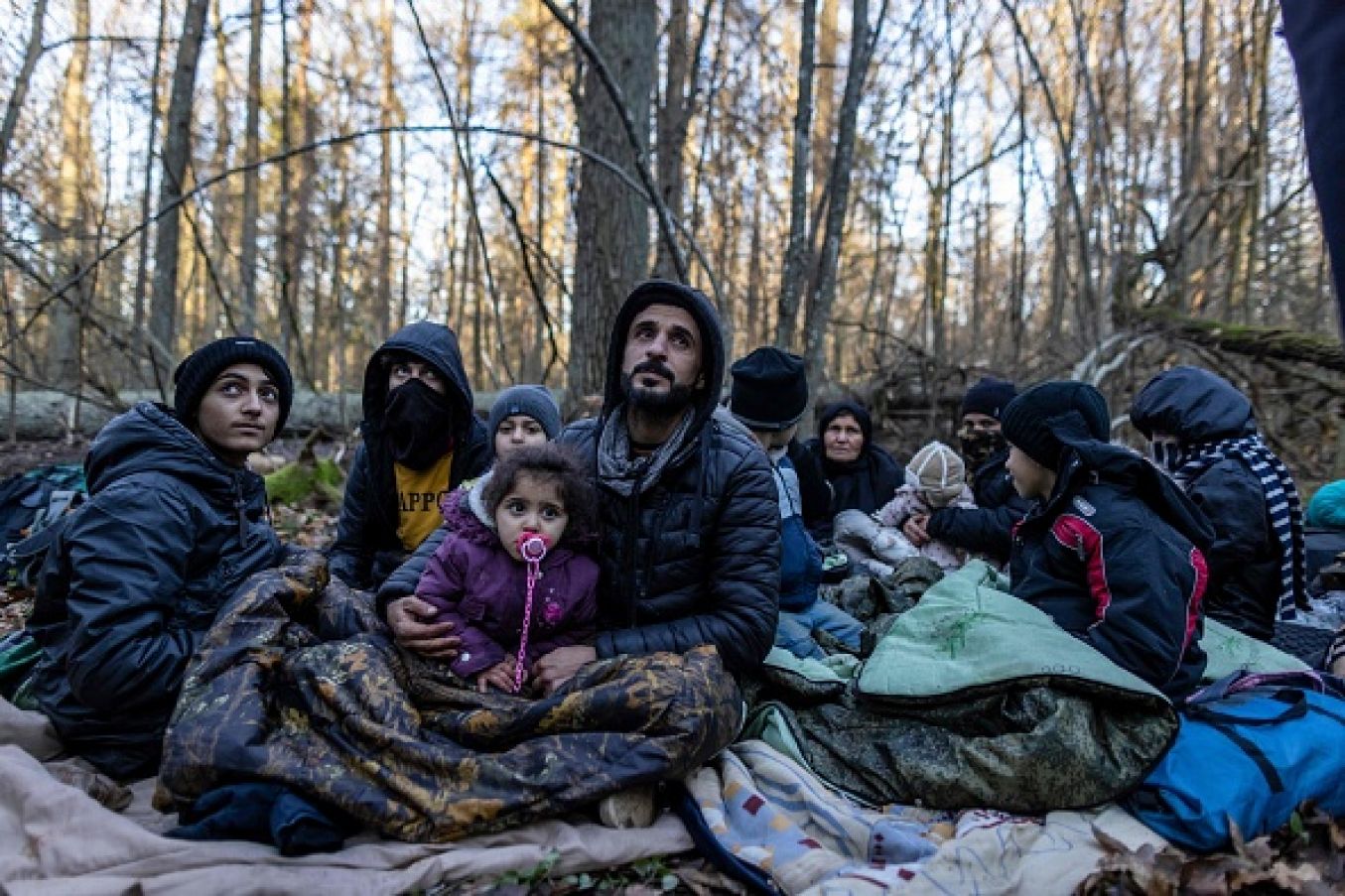 Members Of A Kurdish Family From Dohuk In Iraq In A Forest Near The Polish-Belarus Border. The Three-Generation Family Spent About 20 Days In The Forest And Was Pushed Back To Belarus Eight Times. Photo: Wojtek Radwanski / Afp Via Getty Images