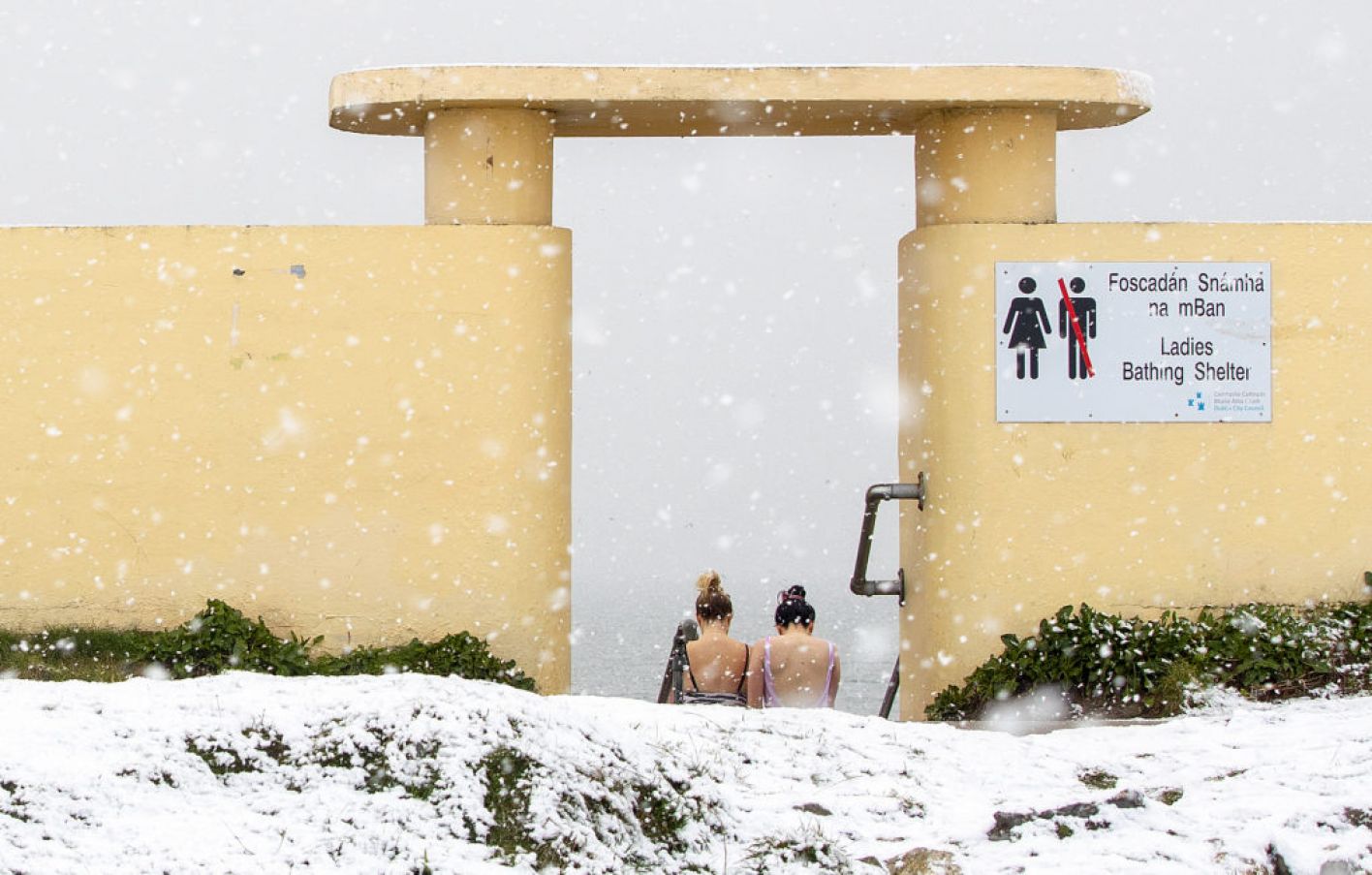 Two Women Preparing To Enter The Irish Sea Off Bull Wall In Dublin, After Much Of Ireland Woke Up To Snow And Ice On January 24Th. Photo: Pa