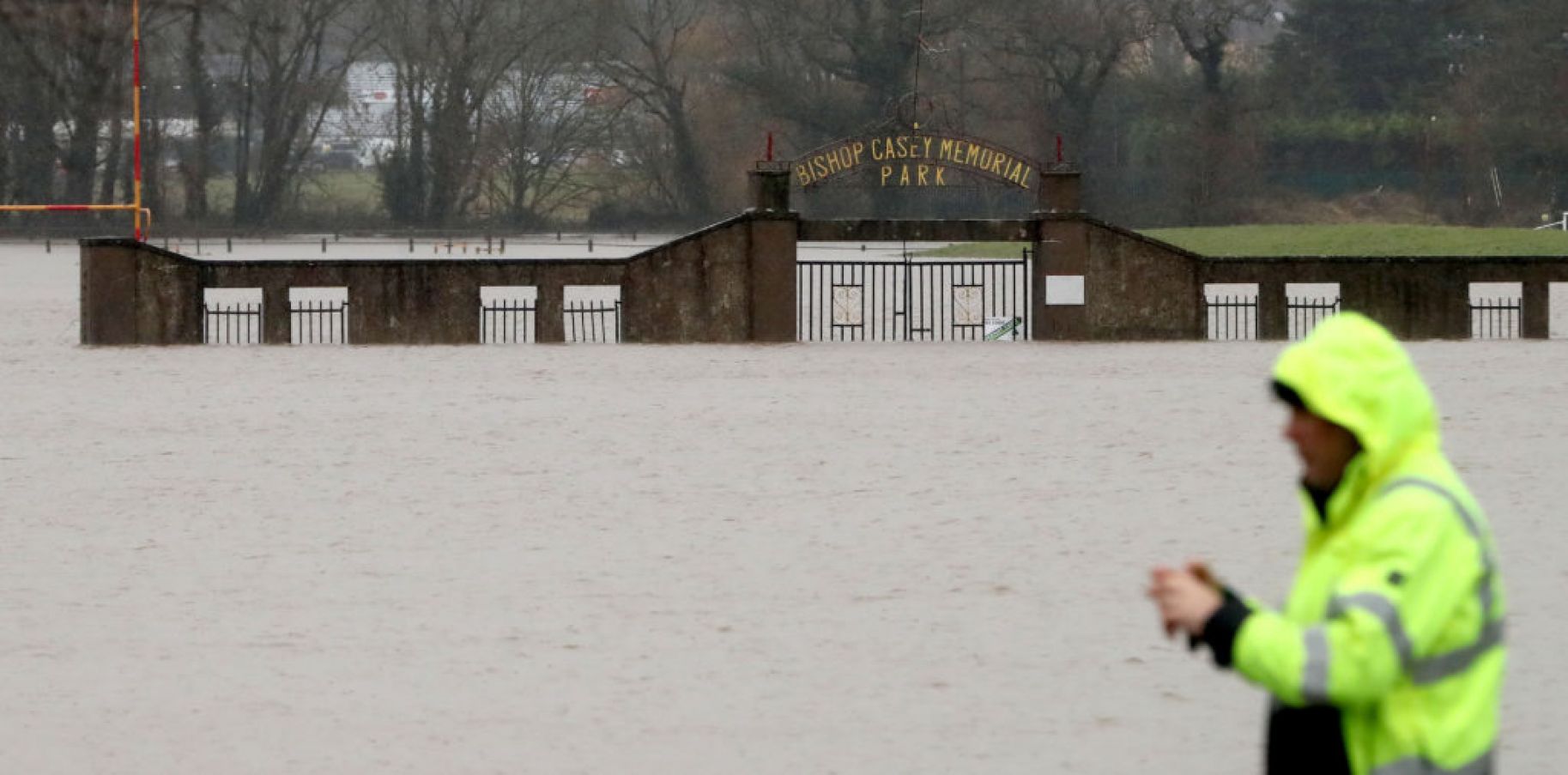 A Man Stops To Take A Picture Of Flood Water At The Bishop Casey Memorial Park In Mallow, Co Cork, After The River Blackwater Burst Its Banks. Photo: Pa