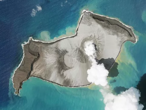 Tsunami Waves Crash Across Shore As Undersea Volcano Erupts Near Tonga