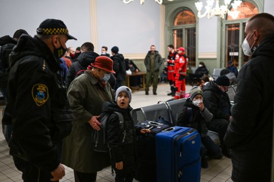 'I Don't Know What To Do': Fleeing Ukrainians Start Arriving In Central Europe