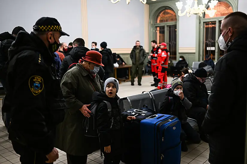 'I Don't Know What To Do': Fleeing Ukrainians Start Arriving In Central Europe