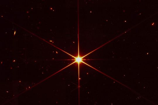 Space Telescope’s Image Of Star Gets Photobombed By Galaxies