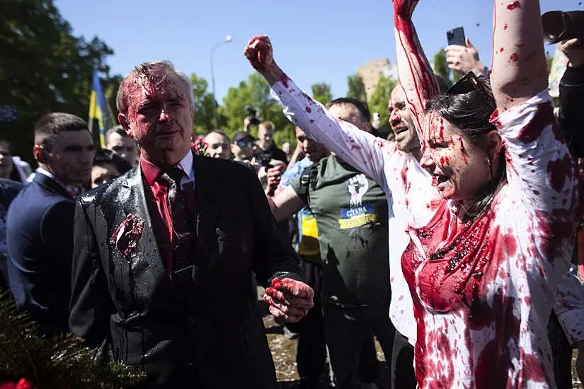 Russian Ambassador To Poland Hit With Red Paint By Protesters