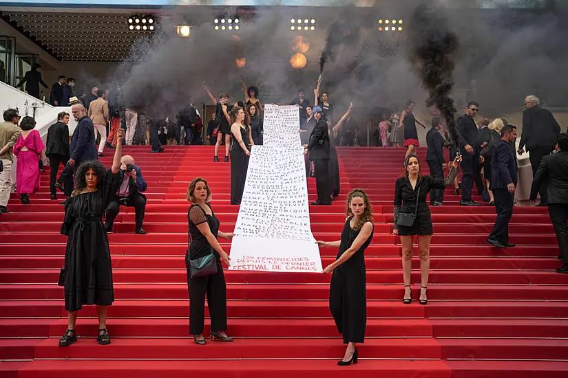 Female Activists Unfurl Banner During Cannes Red Carpet Protest