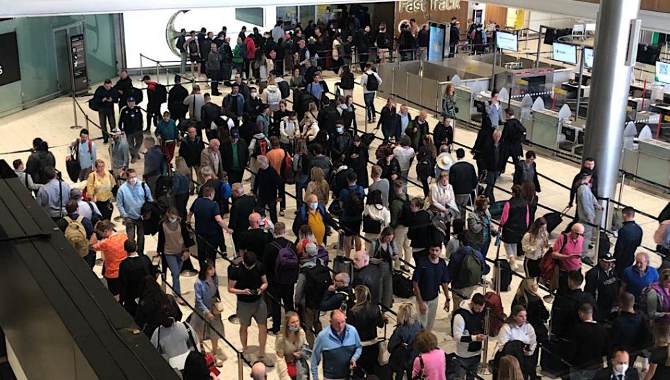Passengers Queue Outside Terminal Buildings At Dublin Airport As 50,000 People Fly Abroad