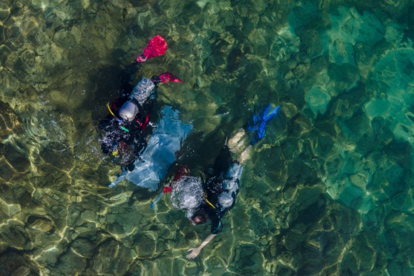 Israeli Divers Haul Rubbish From Ancient Site For Oceans Day