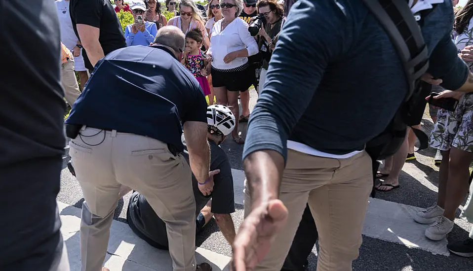 Joe Biden Falls While Getting Off His Bike After Beach Ride