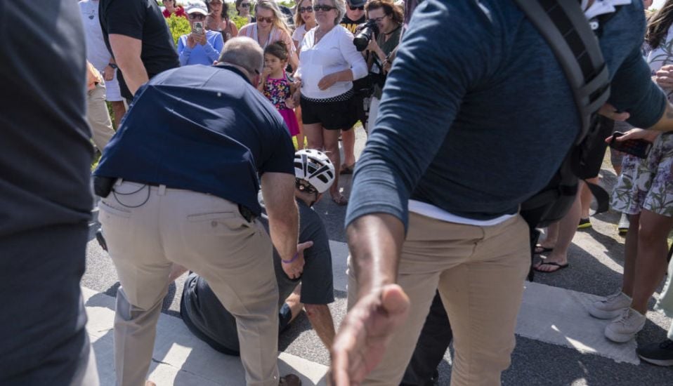 Joe Biden Falls While Getting Off His Bike After Beach Ride