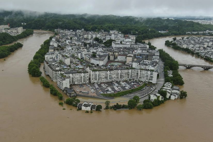 Flooding And Landslides Destroy Buildings And Roads In China