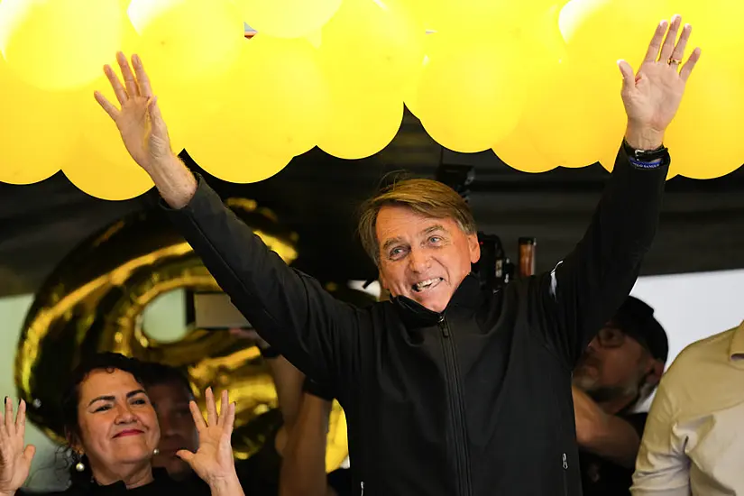 Brazil’s Bolsonaro Grabs At Heckler And Tries To Take Phone