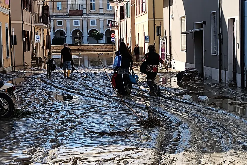 Floods In Italy Kill At Least 10 As People Climb Trees To Find Safety