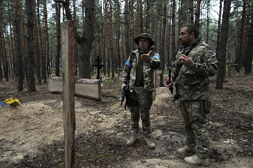 Mass Burial Site Includes Torture Victims, Says Ukraine’s President