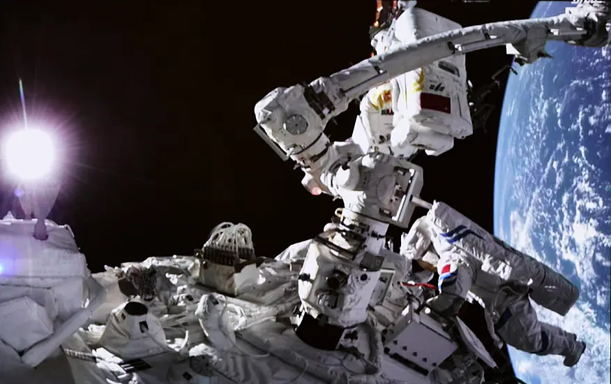 Chinese Astronauts Go On Spacewalk From New Station