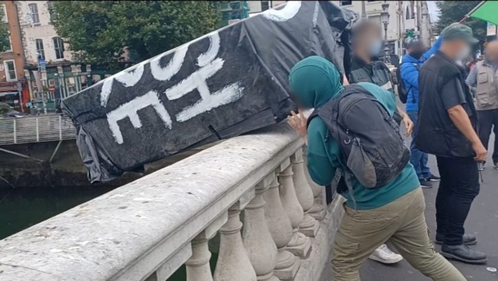 Coffin Marked 'Rip British Empire' Thrown Into Liffey During Anti-Monarchy March