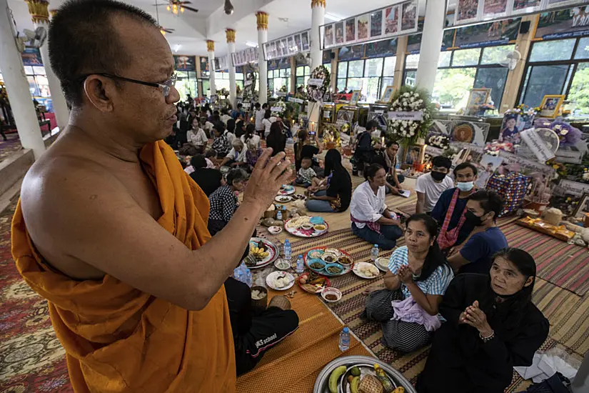 Mourners Pray At Thai Temple Filled With Keepsakes From Nursery Shooting Victims