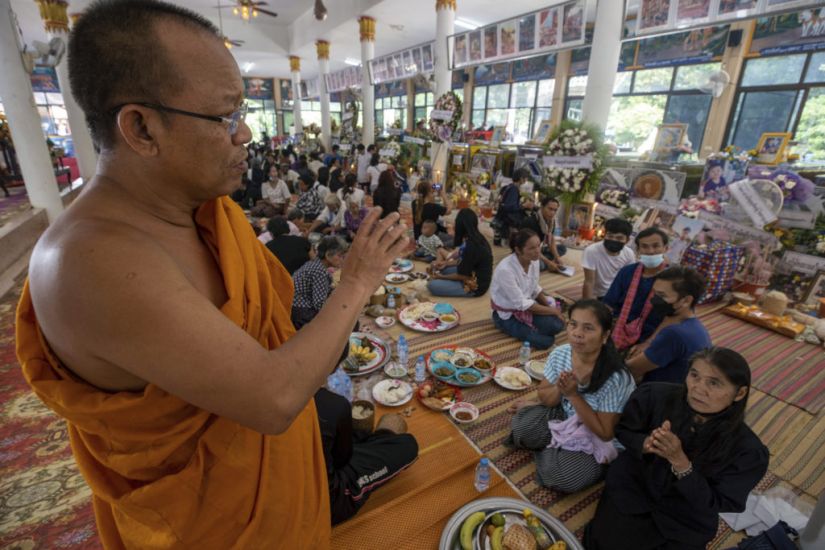 Mourners Pray At Thai Temple Filled With Keepsakes From Nursery Shooting Victims