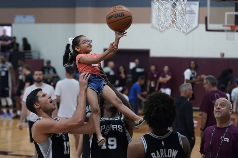 Basketball Stars Lift Children In Visit To Texas Mass Shooting Town
