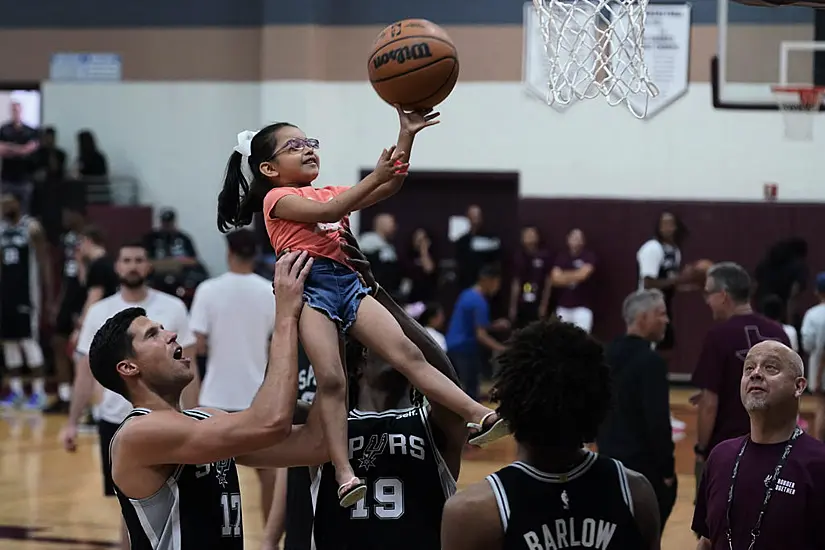 Basketball Stars Lift Children In Visit To Texas Mass Shooting Town