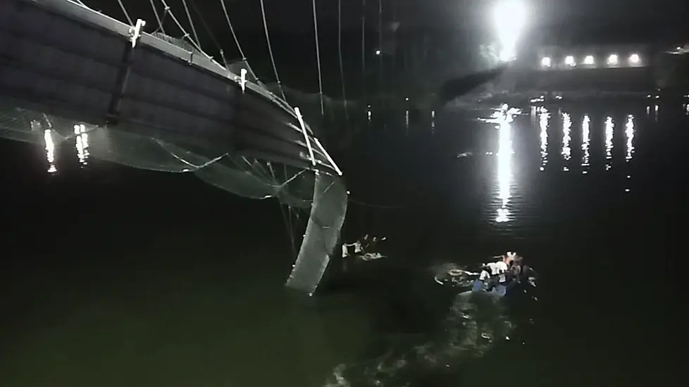 Dozens Die In India After Cable Bridge Collapses Into River