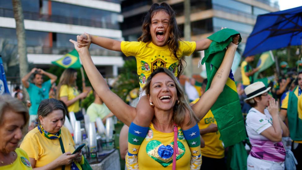 Brazil's Bolsonaro Takes Early Lead Over Lula In Tense Election Runoff