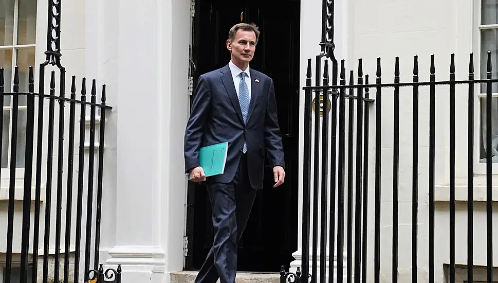 British Chancellor Sets Out Tax Rises And Spending Cuts In The Face Of Economic Storm