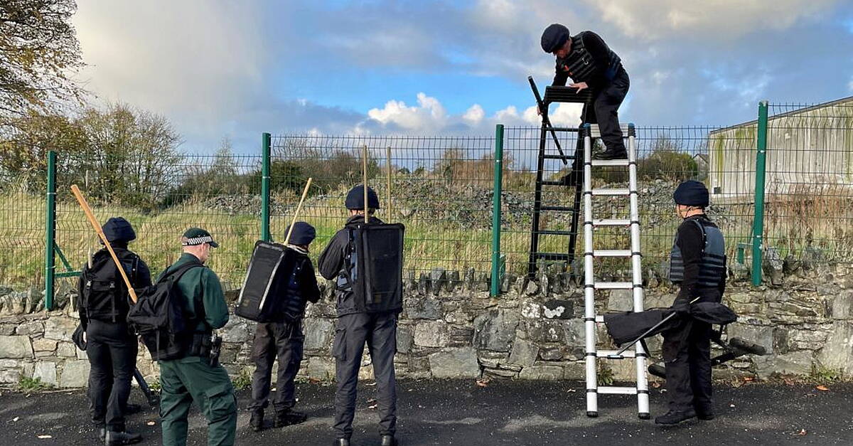 Four men arrested over attempted murder of police released after ...