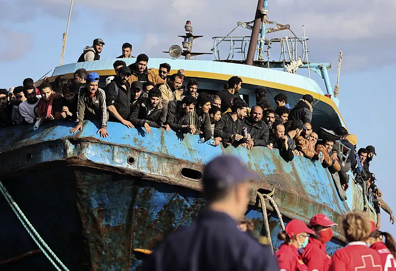 Boat With Hundreds Of Migrants Safely Towed To Port In Greece