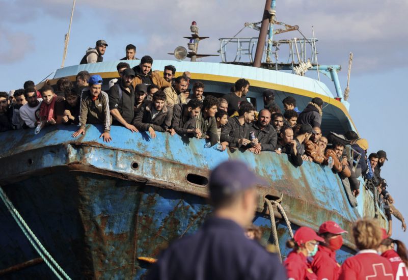 Boat With Hundreds Of Migrants Safely Towed To Port In Greece