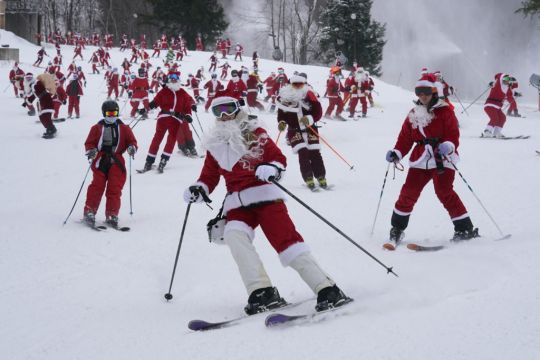 300 Skiing Santas, A Grinch And A Tree Take To Slopes To Spread Christmas Cheer