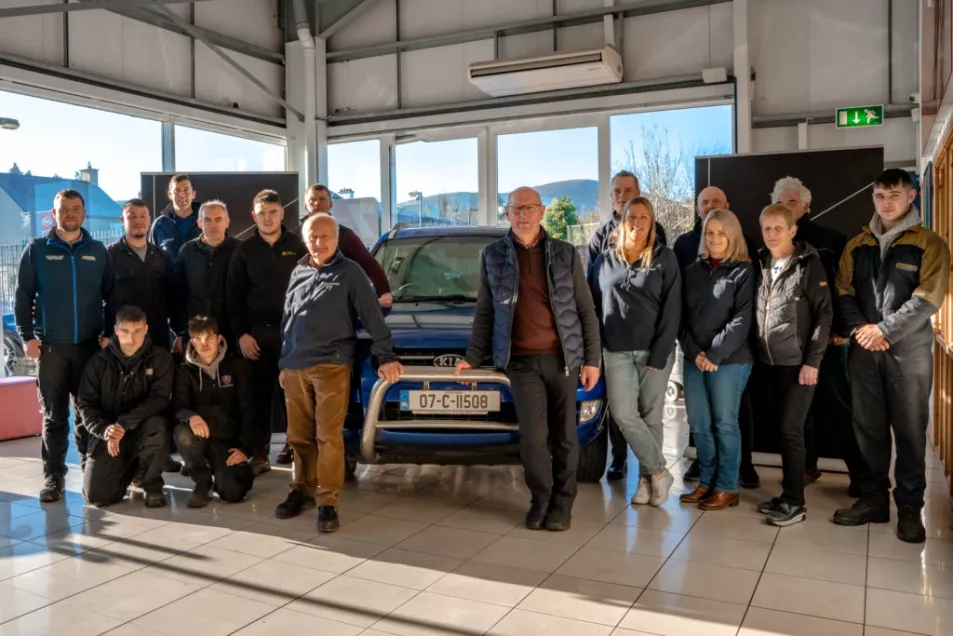 Colleagues at Colemans of Millstreet, Co Cork gather around to celebrate Ben O'Connor's impressively hard-wearing blue Kia Sportage.