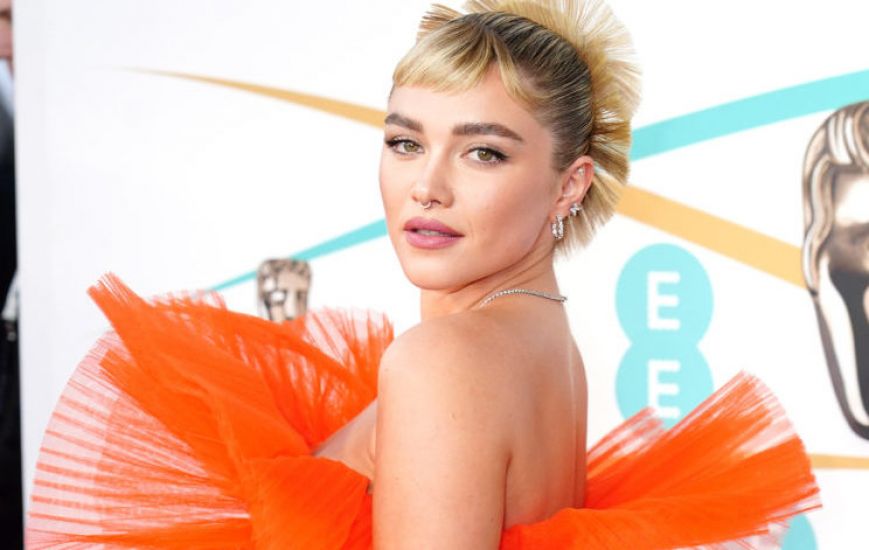 Florence Pugh’s Bright Orange Dress Leads Charge Of Colourful Outfits At Baftas