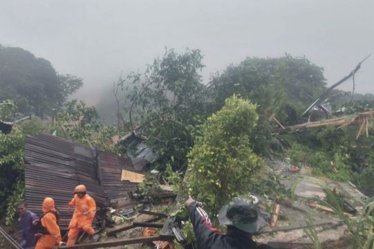 Rescuers Search For Dozens Buried In Indonesian Landslides