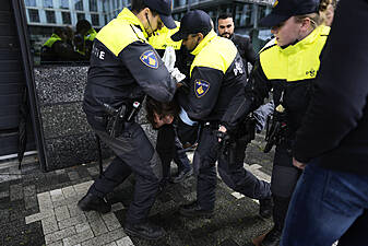 Protester Detained As Emmanuel Macron Visits Amsterdam University