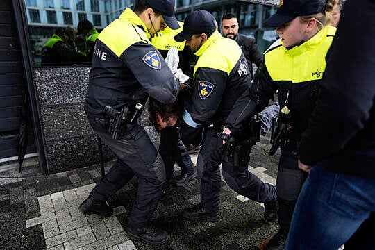 Protester Detained As Emmanuel Macron Visits Amsterdam University