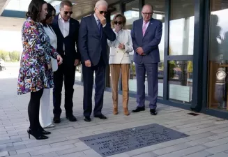 Biden Looks At Plaque In Memory Of Late Son And Meets Distant Cousin At Hospice
