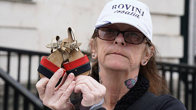 Bereaved Family Members Lay Shoes Of Loved Ones In Protest Against Legacy Bill