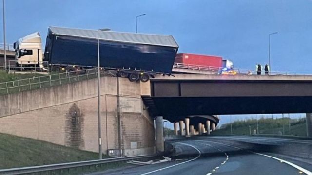 Lorry Left Hanging Above Road After Crashing Into Bridge Barrier