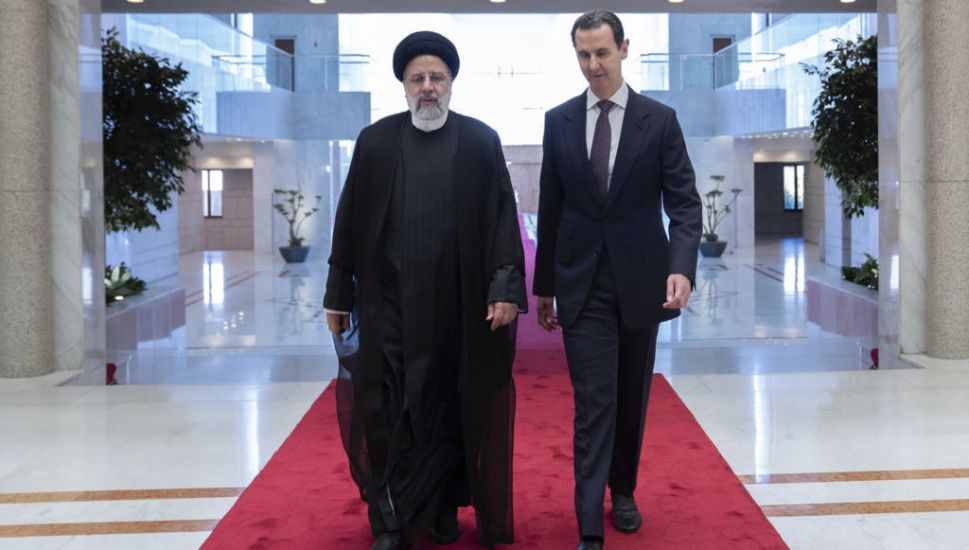 Iranian President Holds Rare Meeting With Assad In Syria