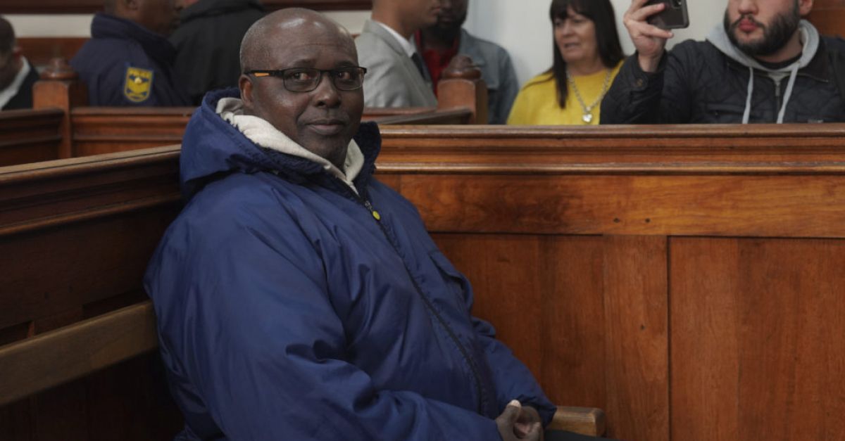 Rwandan genocide suspect appears in court holding Bible after 22 years on run