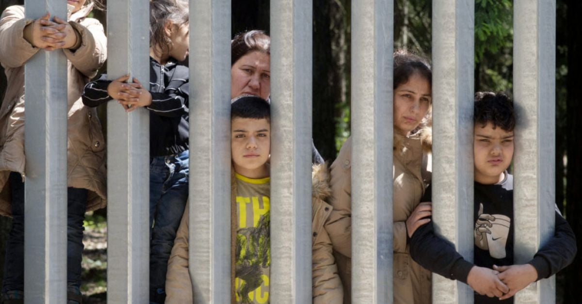 Migrants with children stuck at Poland’s border wall