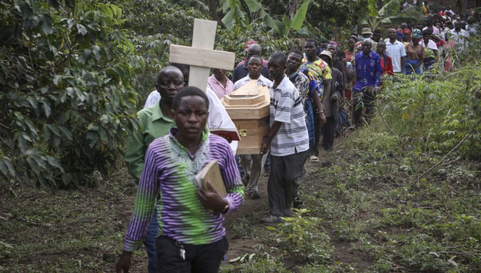 Victims Are Buried After Rebel Attack On Ugandan School Leaves 42 Dead