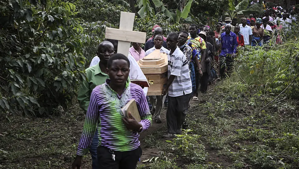 Victims Are Buried After Rebel Attack On Ugandan School Leaves 42 Dead