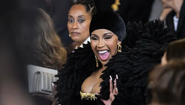 Cardi B Dons Dramatic Feather-Like Bolero At Paris Fashion Week