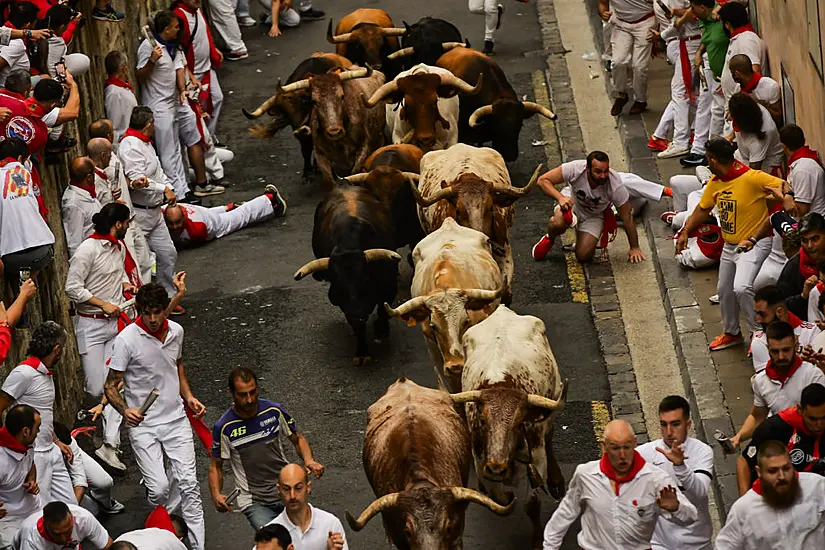 Thousands Take Part In First Running Of The Bulls In Annual San Fermin Festival