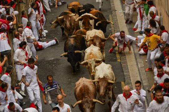 Thousands Take Part In First Running Of The Bulls In Annual San Fermin Festival