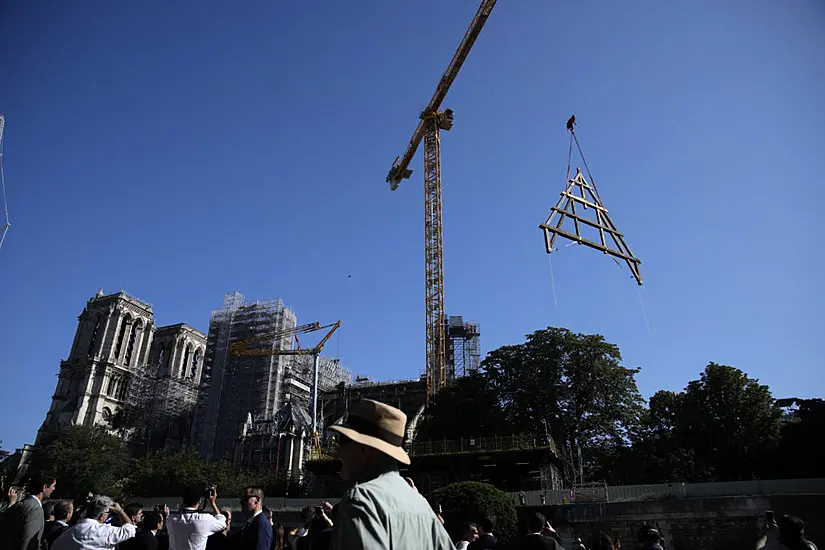 Paris Crowds Watch As Oak Trusses Raised To Roof Of Notre Dame Cathedral