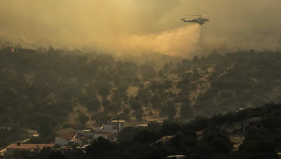 Down Woman Describes 'Devastating' Wildfires In Greece