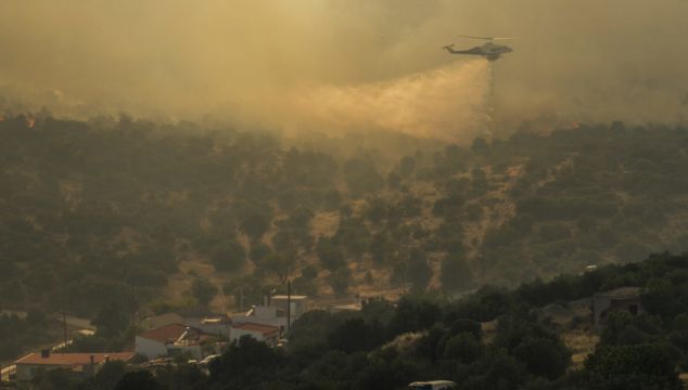 Down Woman Describes 'Devastating' Wildfires In Greece